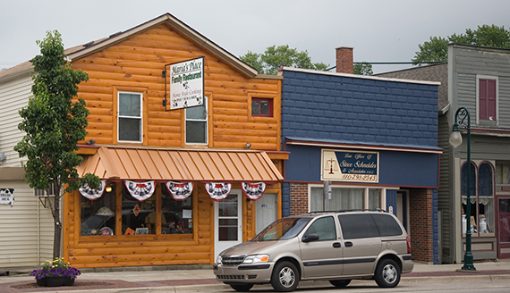 Small town street with wooden and blue storefronts