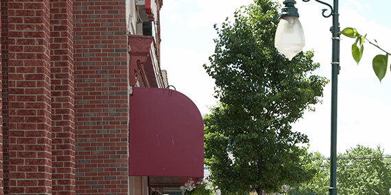 Quaint downtown street with historic buildings and lamp post.